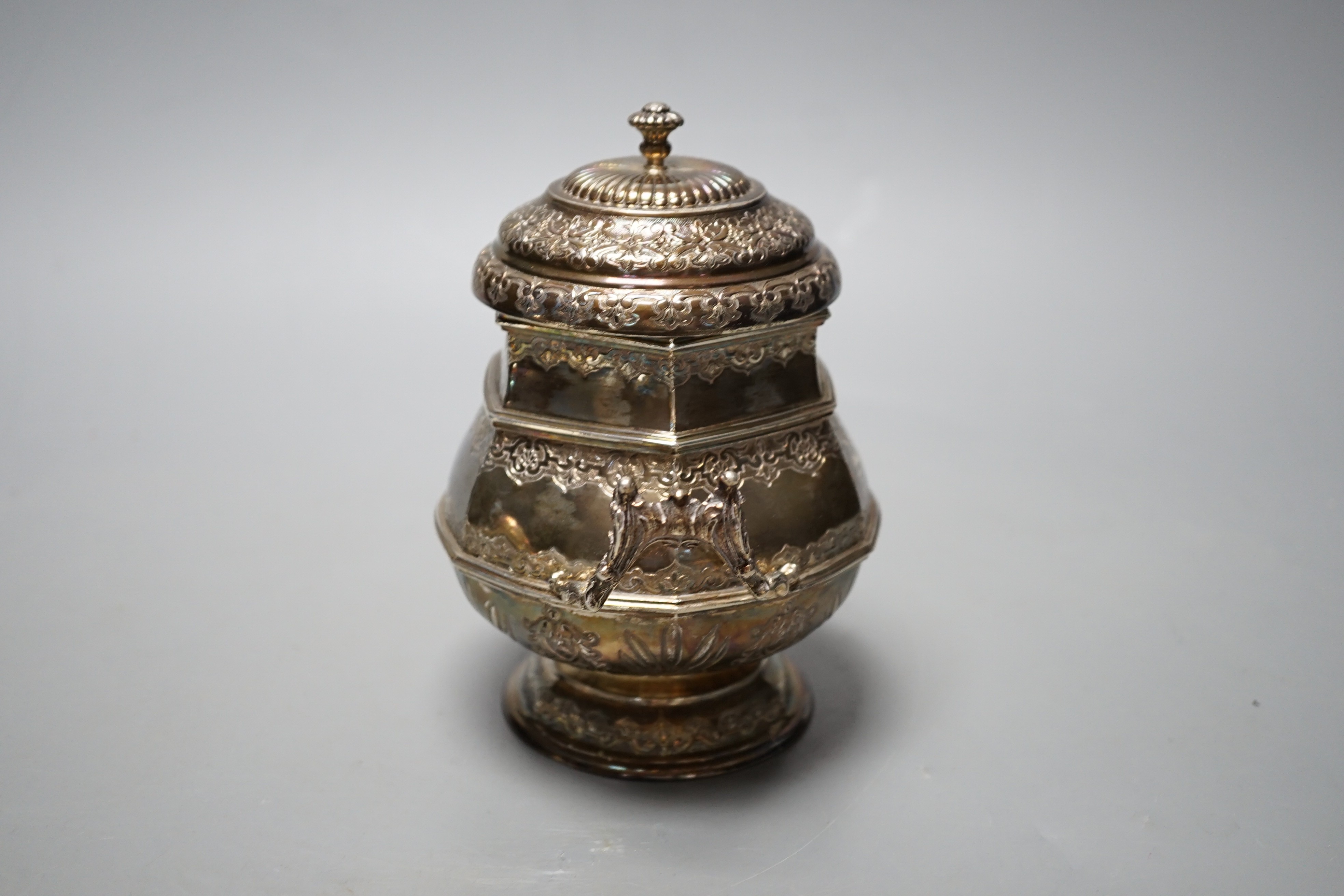 A French silver two handled hexagonal sugar bowl and cover, with London import marks for 1957, height 14.2cm, 12oz.